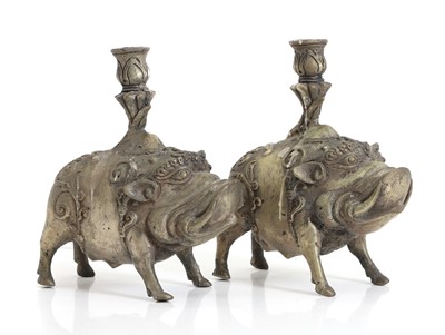Lot 136 - A pair of candlestick holders in the form of boars