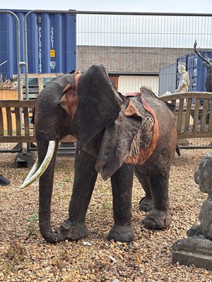 Lot 596 - A wooden garden ornament of an elephant