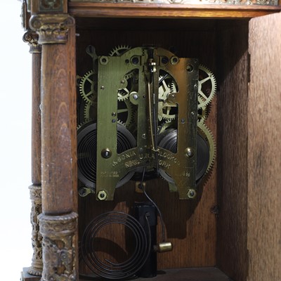 Lot 384 - A oak and gilt-metal mantel clock