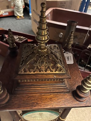 Lot 384 - A oak and gilt-metal mantel clock