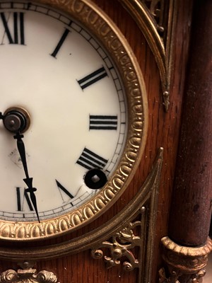 Lot 384 - A oak and gilt-metal mantel clock
