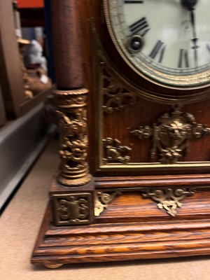 Lot 384 - A oak and gilt-metal mantel clock