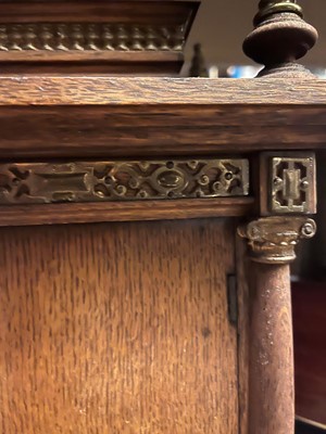 Lot 384 - A oak and gilt-metal mantel clock