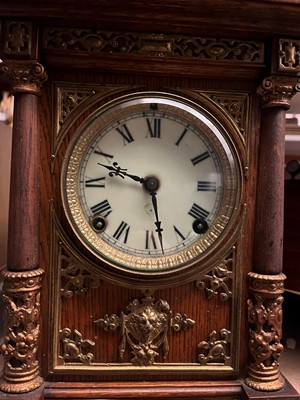 Lot 384 - A oak and gilt-metal mantel clock