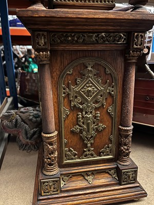 Lot 384 - A oak and gilt-metal mantel clock