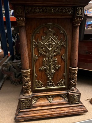 Lot 384 - A oak and gilt-metal mantel clock