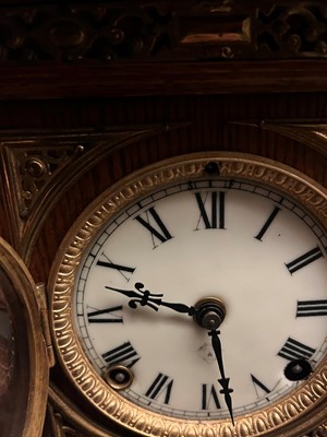Lot 384 - A oak and gilt-metal mantel clock