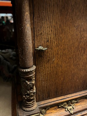 Lot 384 - A oak and gilt-metal mantel clock