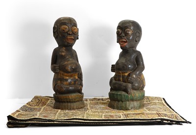 Lot 429 - A pair of carved hardwood tribal figures