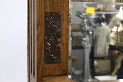 Lot 621 - An Art and Crafts oak mirror back cabinet sideboard
