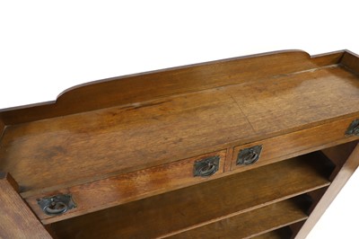 Lot 543 - An Arts and Crafts dwarf open bookcase