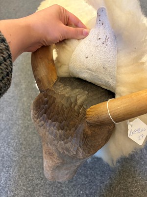 Lot 532 - A 'Goring Hotel' carved oak and wool sheep stool