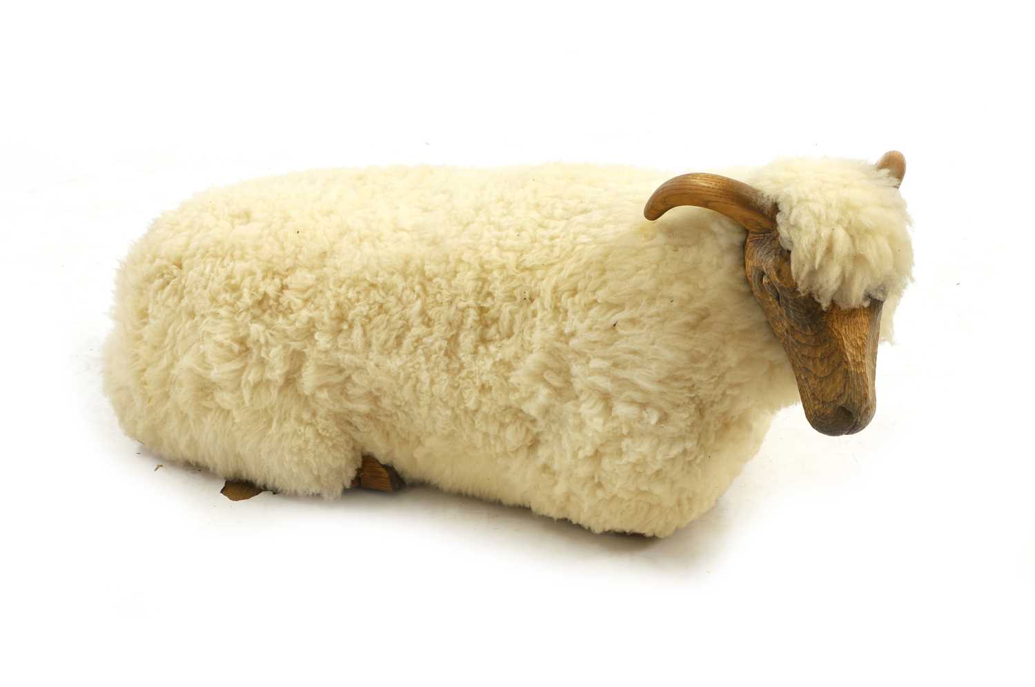 Lot 532 - A 'Goring Hotel' carved oak and wool sheep stool