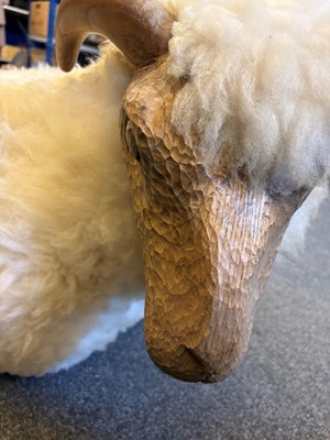 Lot 532 - A 'Goring Hotel' carved oak and wool sheep stool
