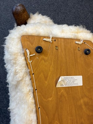 Lot 532 - A 'Goring Hotel' carved oak and wool sheep stool