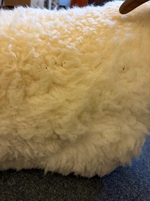 Lot 532 - A 'Goring Hotel' carved oak and wool sheep stool