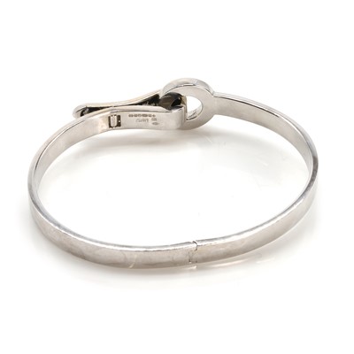 Lot 136 - An 18ct gold diamond 'Bond' bangle, by Asprey