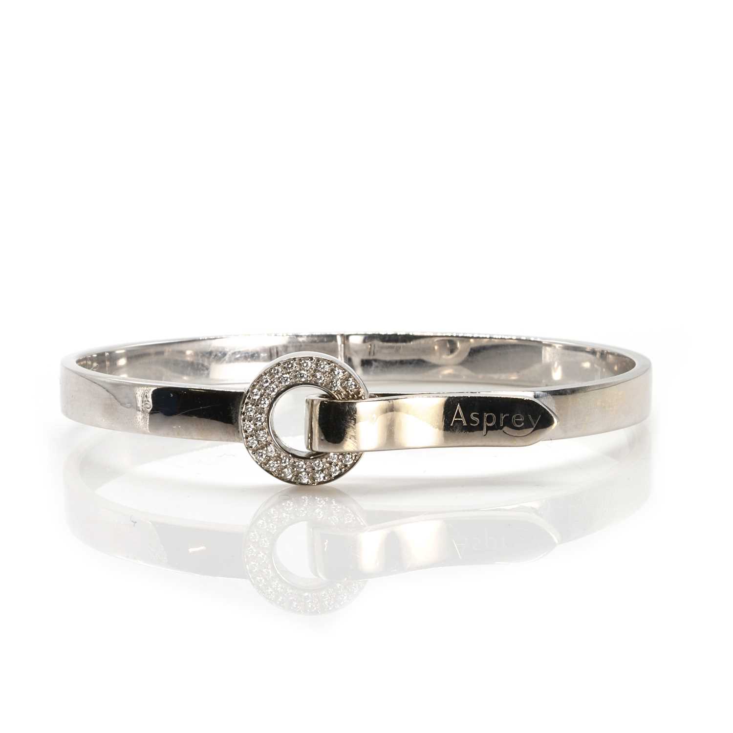 Lot 136 - An 18ct gold diamond 'Bond' bangle, by Asprey