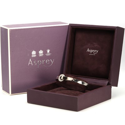 Lot 136 - An 18ct gold diamond 'Bond' bangle, by Asprey