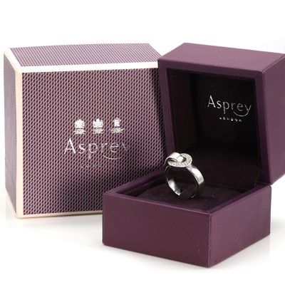 Lot 243 - An 18ct gold diamond 'Bond' ring, by Asprey