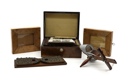 Lot 427 - A hand held wooden stereoscopic viewer