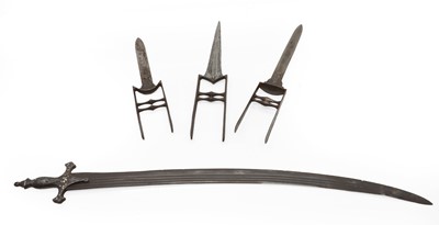 Lot 126 - A group of three Katar daggers