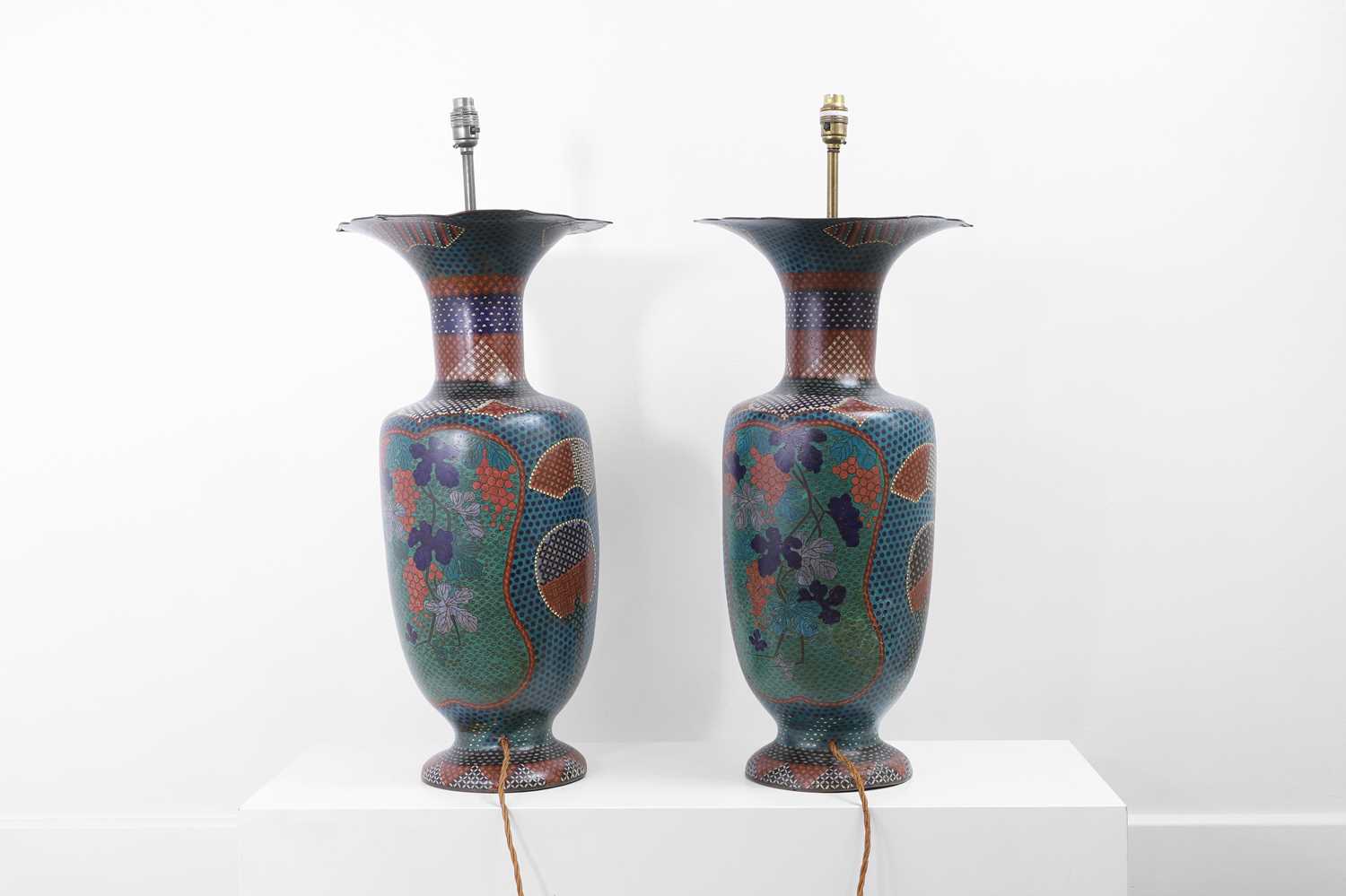 Lot 34 - A pair of polychrome cloisonné enamel lamps