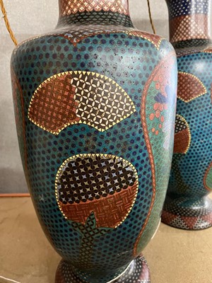 Lot 34 - A pair of polychrome cloisonné enamel lamps