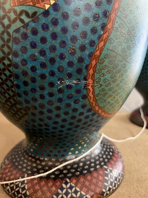 Lot 34 - A pair of polychrome cloisonné enamel lamps