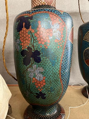 Lot 34 - A pair of polychrome cloisonné enamel lamps