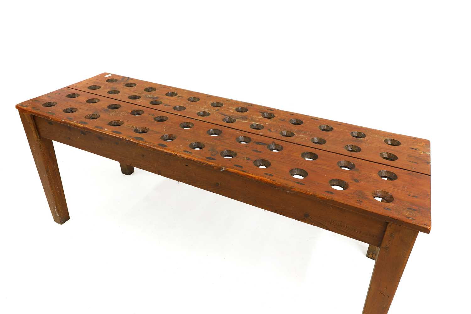 Lot 744 - A pine wine bottle table
