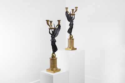 Lot 81 - A pair of Empire ormolu and patinated bronze candelabra