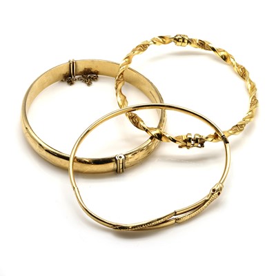 Lot 339 - A group of three 9ct gold bangles