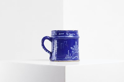 Lot 4 - An English delft chinoiserie mug