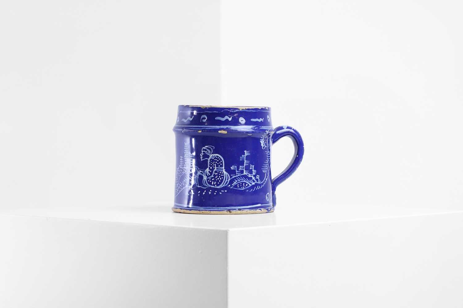 Lot 4 - An English delft chinoiserie mug