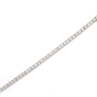 Lot 134 - A mid-20th century 14ct white gold diamond line bracelet