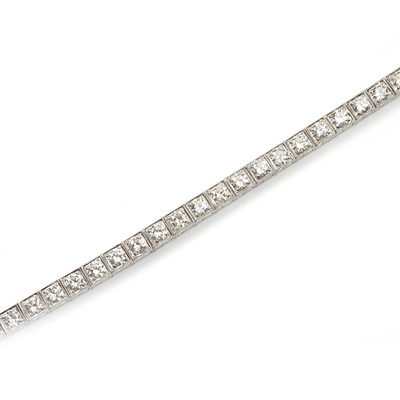 Lot 134 - A mid-20th century 14ct white gold diamond line bracelet