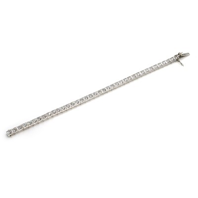 Lot 134 - A mid-20th century 14ct white gold diamond line bracelet