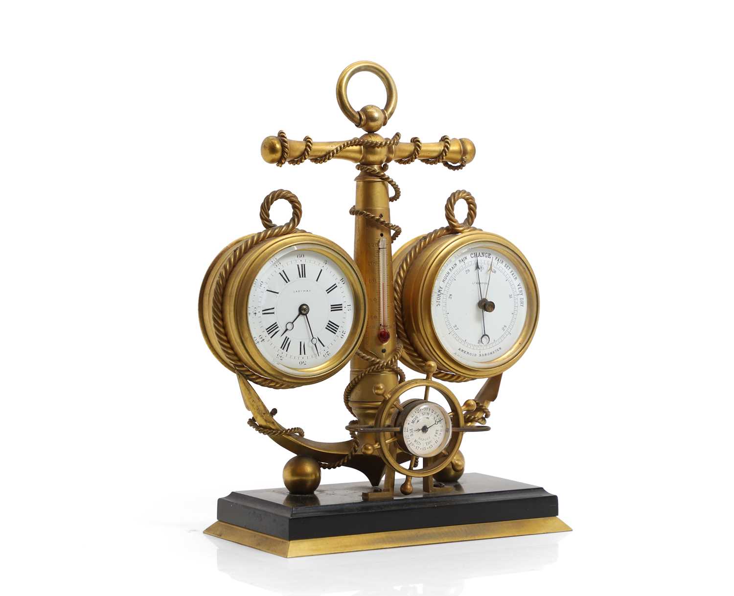 Lot 277 - A Nautical gilt cased clock / barometer desk stand