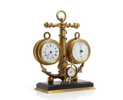 Lot 277 - A Nautical gilt cased clock / barometer desk stand