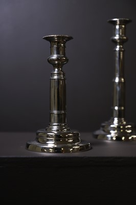 Lot 306 - A pair of George III paktong telescopic candlesticks