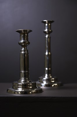 Lot 306 - A pair of George III paktong telescopic candlesticks