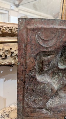 Lot 127 - A gilt-copper repoussé temple plaque