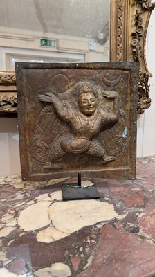 Lot 127 - A gilt-copper repoussé temple plaque
