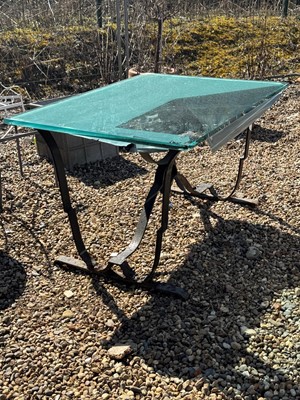 Lot 551 - A glass top garden table