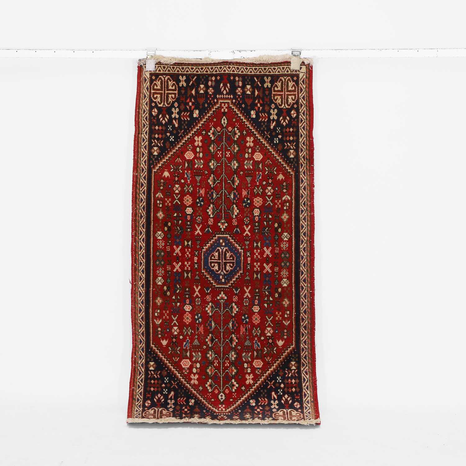 Lot 185 - A wool rug
