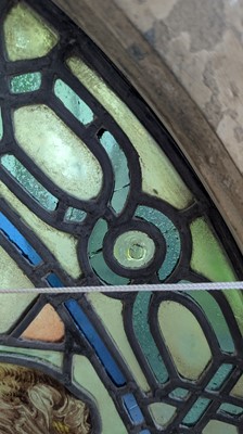 Lot 500 - A Pre-Raphaelite oval stained-glass window panel