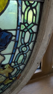Lot 500 - A Pre-Raphaelite oval stained-glass window panel