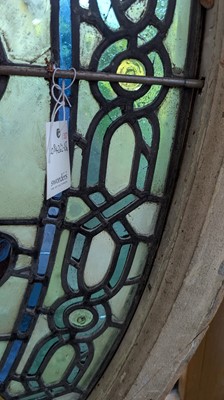 Lot 500 - A Pre-Raphaelite oval stained-glass window panel