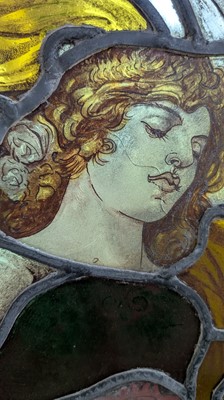 Lot 500 - A Pre-Raphaelite oval stained-glass window panel